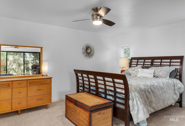 bedroom featuring baseboards and light carpet