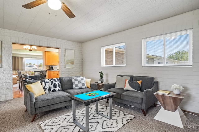 living room featuring ceiling fan and carpet floors