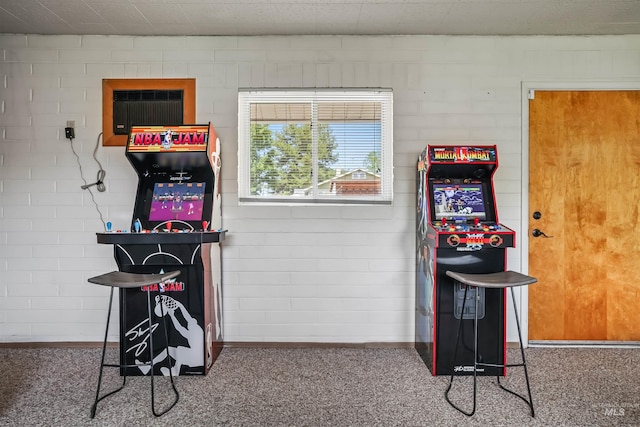 playroom with an AC wall unit and carpet floors