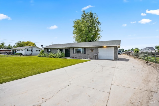 single story home with a garage and a front yard