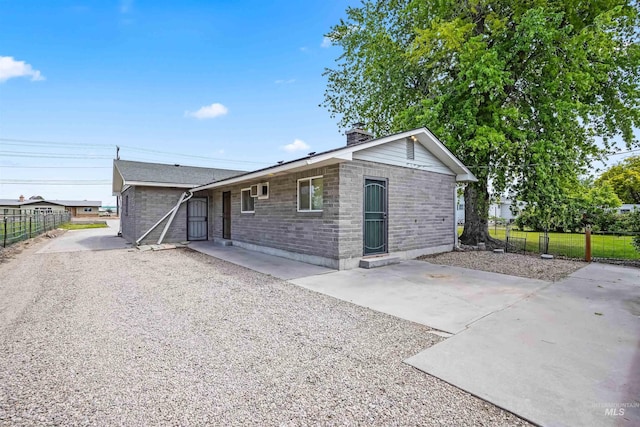 ranch-style home featuring a patio area