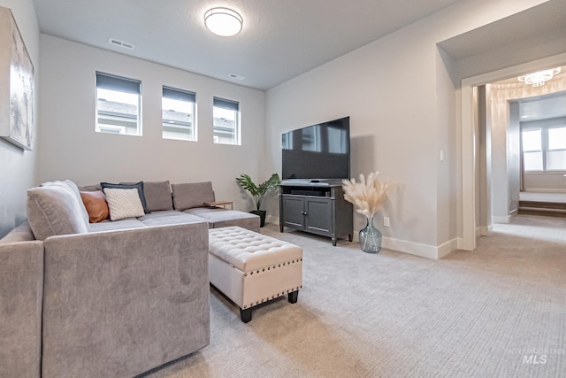 carpeted living room with a wealth of natural light