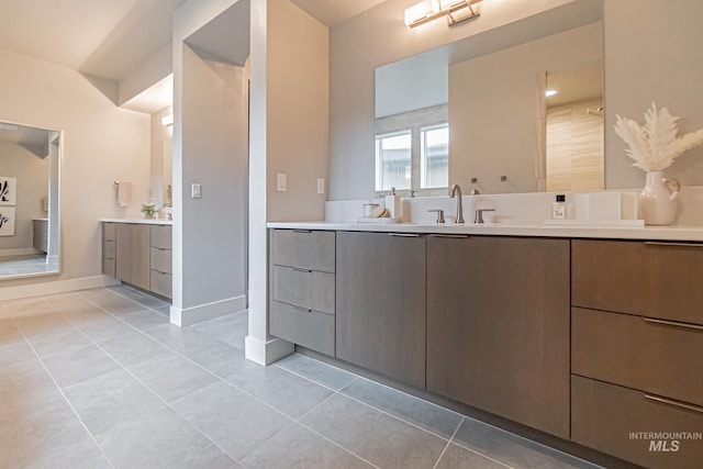 bathroom featuring tile patterned flooring and vanity