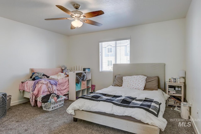 carpeted bedroom with baseboards and a ceiling fan