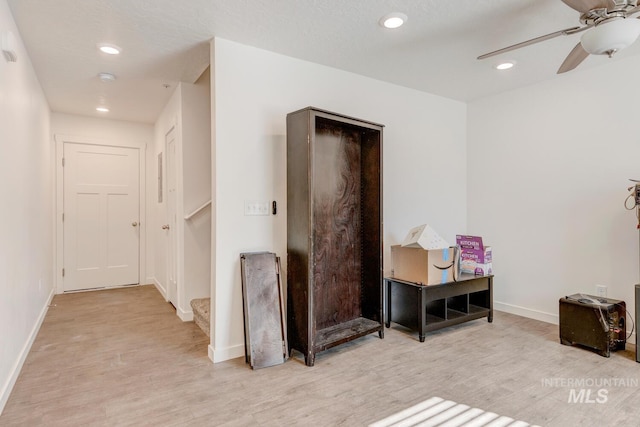 interior space with recessed lighting, light wood-type flooring, baseboards, and ceiling fan