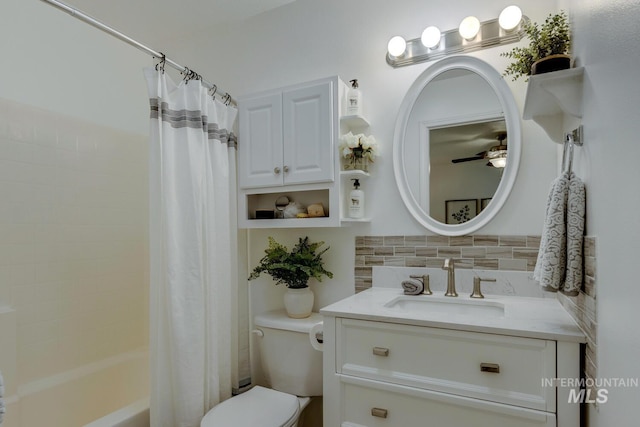 full bathroom featuring decorative backsplash, vanity, shower / tub combo, and toilet