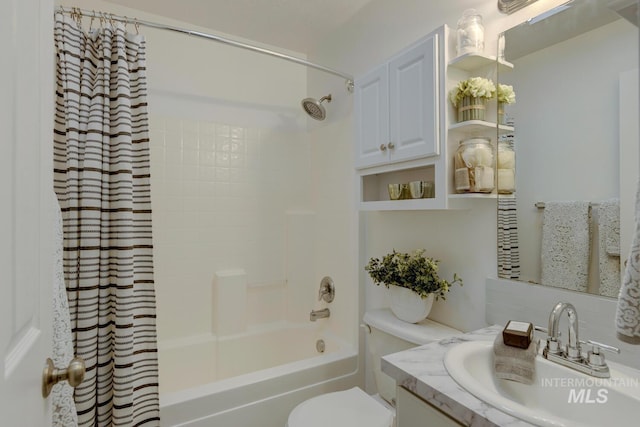 full bathroom featuring shower / bath combo with shower curtain, vanity, and toilet