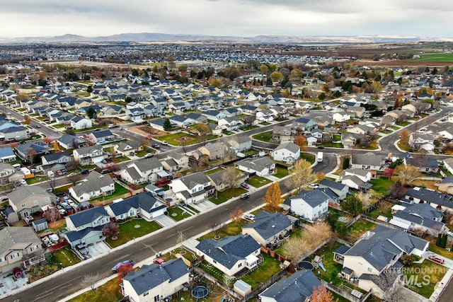 birds eye view of property featuring a mountain view