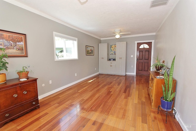 2155 N 24th St, Boise, ID 83702 - foyer with light wood-style floors, baseboards, a ceiling fan, and ornamental molding