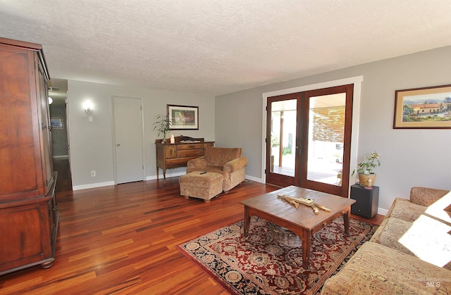 2155 N 24th St, Boise, ID 83702 - living area with dark wood-type flooring, a textured ceiling, and baseboards