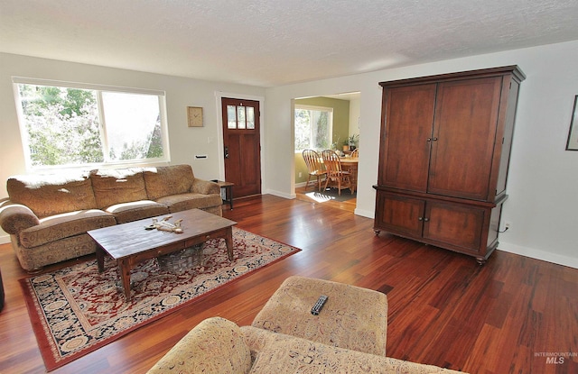 2155 N 24th St, Boise, ID 83702 - living room with healthy amount of natural light, wood finished floors, and baseboards