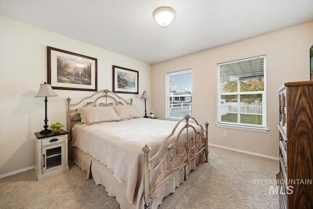 bedroom with light colored carpet