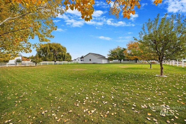 view of yard with a rural view