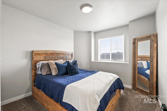 carpeted bedroom with baseboards