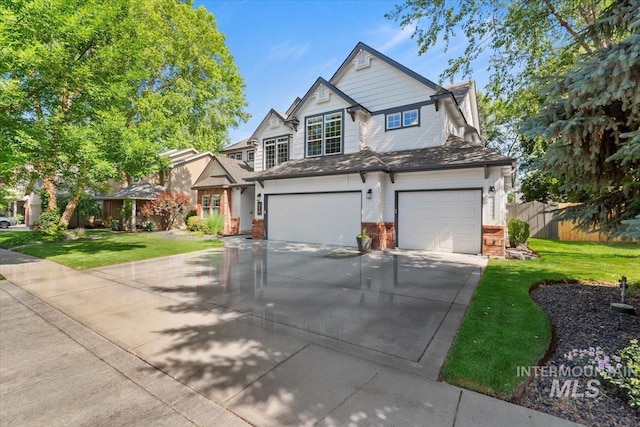 516 E Ridge Dr, Eagle, ID 83616 - view of front of house featuring a garage, driveway, and brick siding