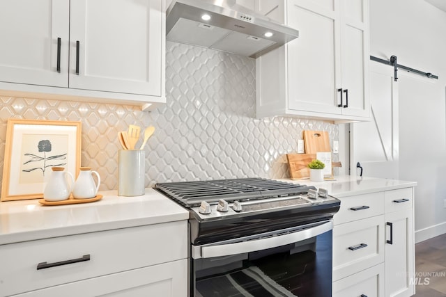 kitchen with white cabinetry, gas range, and under cabinet range hood
