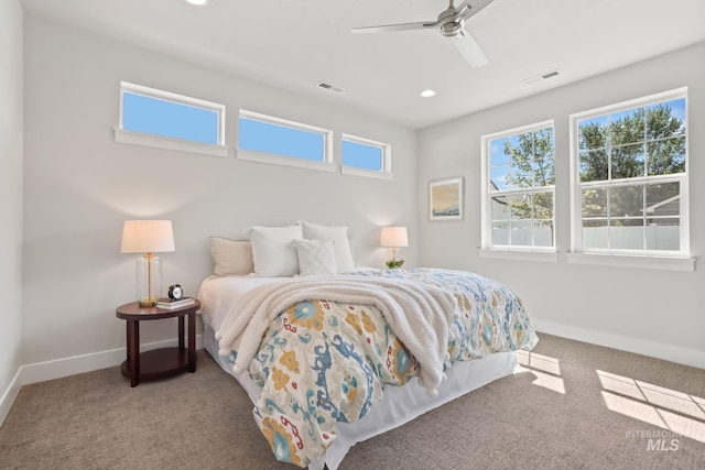 bedroom with visible vents, ceiling fan, carpet, and baseboards