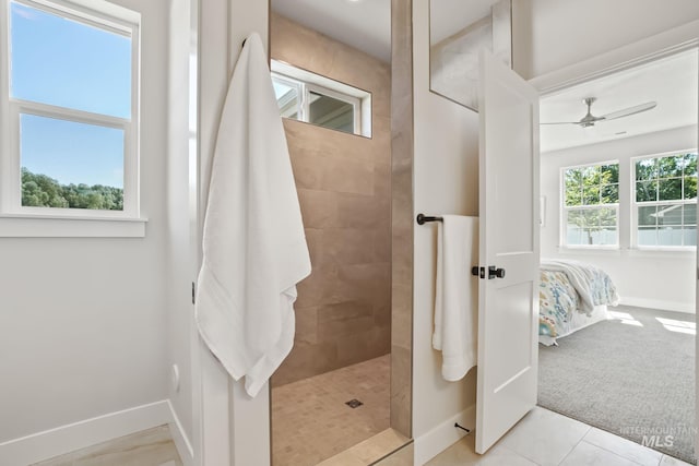 ensuite bathroom featuring baseboards, ceiling fan, a walk in shower, tile patterned floors, and connected bathroom