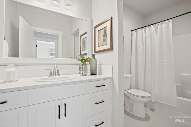 bathroom featuring vanity, shower / bath combination with curtain, and toilet