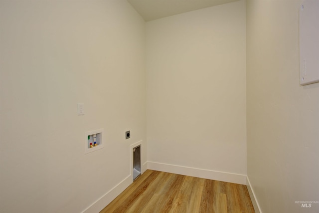 clothes washing area featuring washer hookup, light wood-style floors, baseboards, hookup for an electric dryer, and laundry area