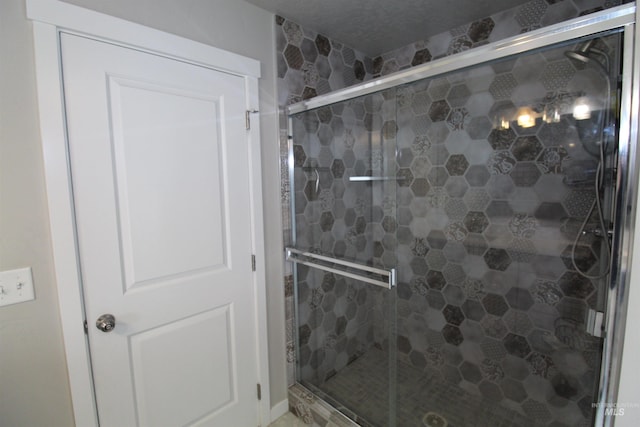 bathroom featuring a shower stall