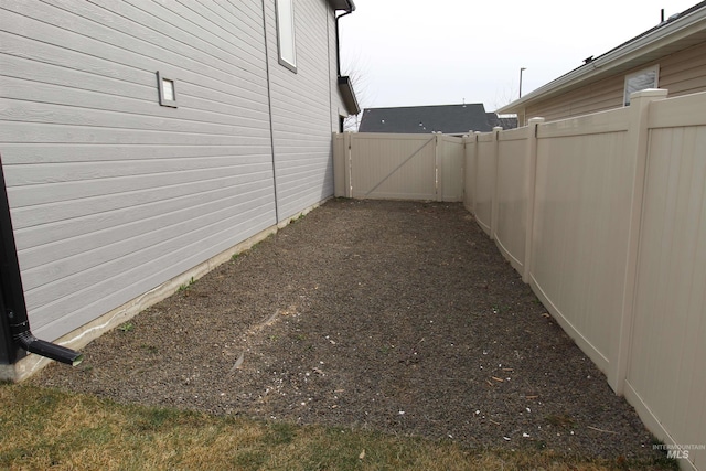 view of yard featuring a gate and fence