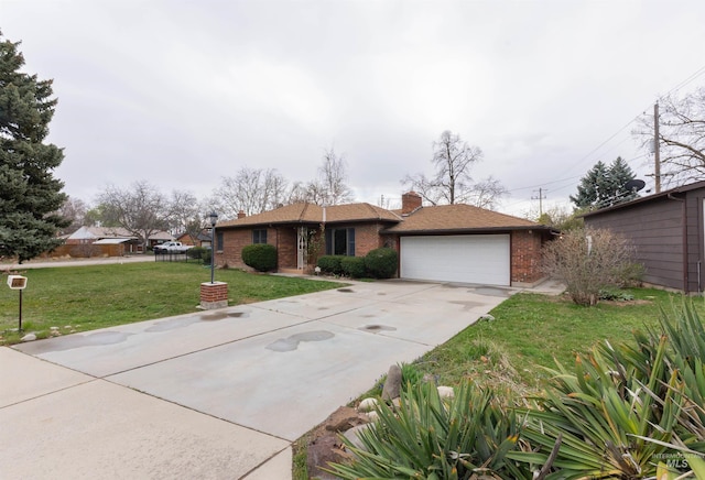 ranch-style house with a garage, a front lawn, brick siding, a chimney, and driveway