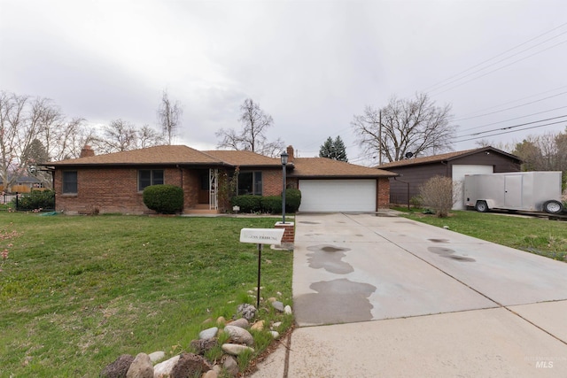 ranch-style house featuring a chimney, driveway, a front lawn, and brick siding