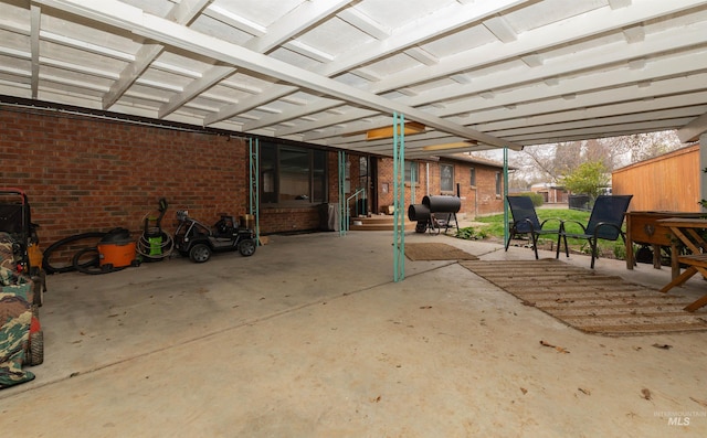 view of patio featuring a grill