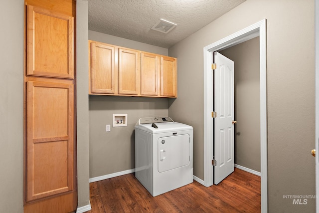 laundry room with visible vents, washer / dryer, dark wood-style flooring, baseboards, and cabinet space