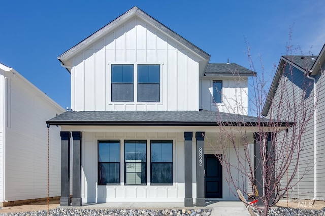 modern farmhouse style home featuring covered porch