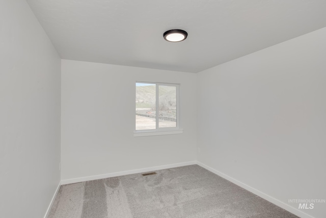 empty room featuring carpet