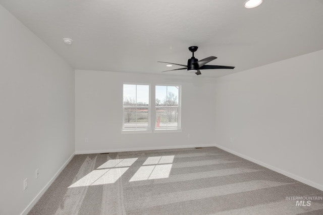 carpeted empty room with ceiling fan