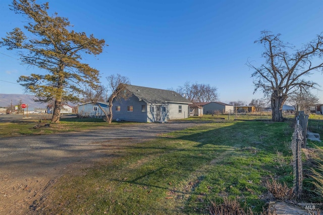 view of home's exterior with a yard