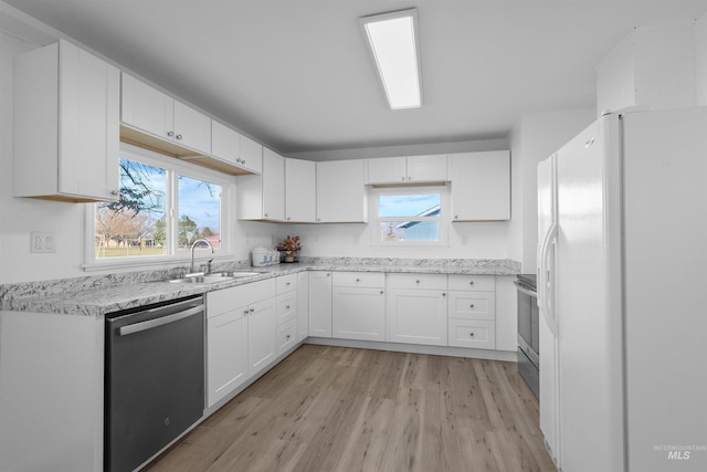 kitchen with sink, stainless steel range with electric cooktop, white cabinetry, dishwasher, and white fridge with ice dispenser