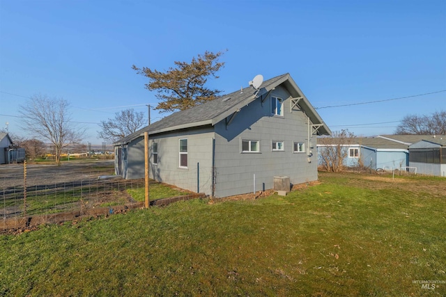 view of property exterior with a yard