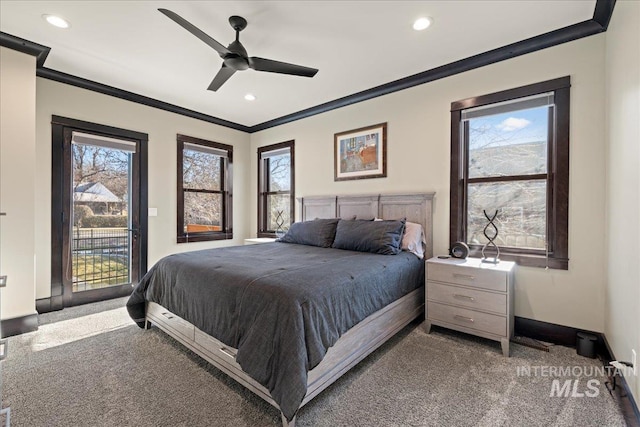 carpeted bedroom featuring ceiling fan, access to outside, crown molding, and multiple windows