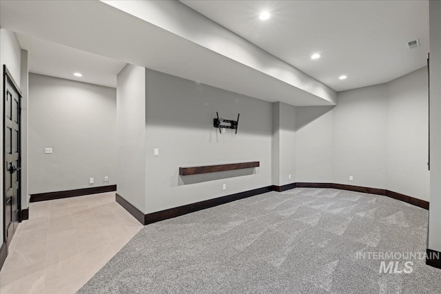 basement with light colored carpet