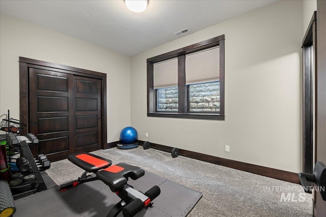 exercise room featuring carpet