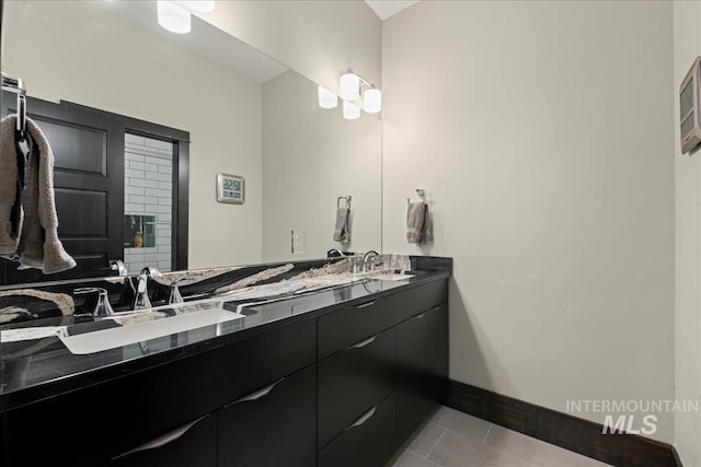 bathroom featuring tile patterned flooring and vanity