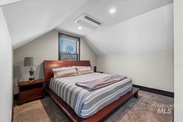 bedroom featuring dark carpet and vaulted ceiling