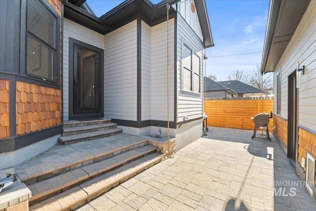 doorway to property featuring a patio area