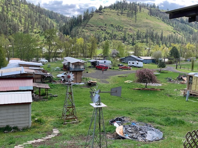 exterior space with a mountain view and a shed