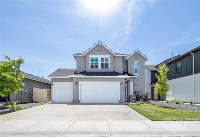 4953 W Apgar St, Meridian, ID 83646 - view of front of house with a garage, concrete driveway, and board and batten siding