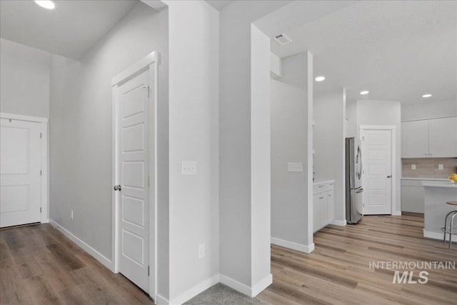 4953 W Apgar St, Meridian, ID 83646 - hall featuring light wood-style flooring, recessed lighting, and baseboards