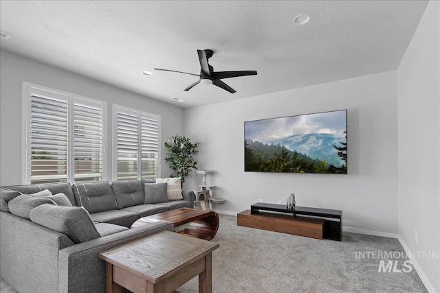 4953 W Apgar St, Meridian, ID 83646 - carpeted living room with ceiling fan, baseboards, and a textured ceiling