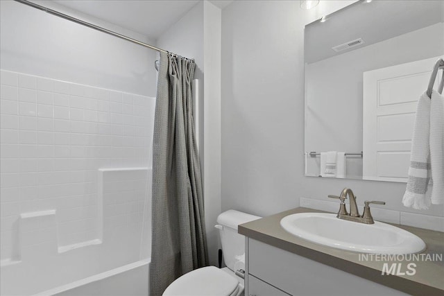 4953 W Apgar St, Meridian, ID 83646 - full bathroom featuring vanity, toilet, and shower / tub combo with curtain