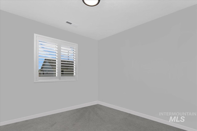 4953 W Apgar St, Meridian, ID 83646 - spare room featuring baseboards and dark colored carpet