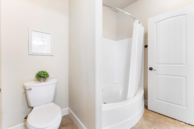 full bathroom with toilet, tile patterned flooring, baseboards, and shower / tub combo with curtain