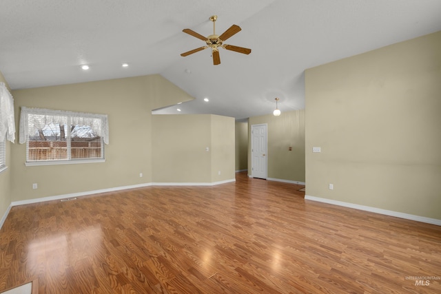 unfurnished living room featuring baseboards, lofted ceiling, ceiling fan, light wood-style floors, and recessed lighting